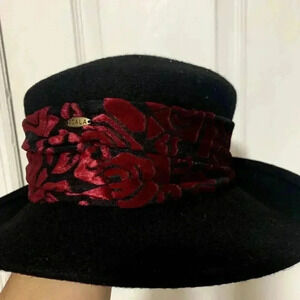 Vintage SCALA 100% wool women's black hat, rose bandana style around the hat.